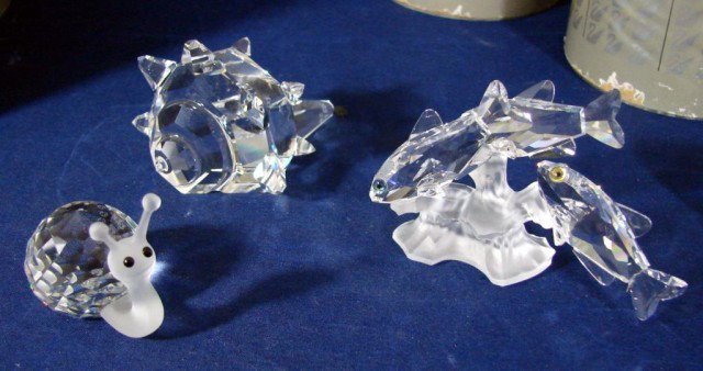 Swarovski Three South Seas Fish & Shell, Snail: Swarovski Three South Seas Fish. #7644 05, South Seas Shell, #7624 072, & a Snail, #7648-030, original boxes, no chips or scratches.