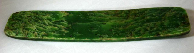 Olmec Jade Celt (stone ax): Jadeite Olmec Celt, (an ax of stone or metal without perforations or grooves, for hafting) beautifully grained, 11" long x 2 3/8" wide.