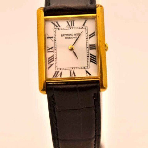 Man's Raymond Weil tank watch: Man's Raymond Weil tank watch with white roman dial, Swiss quartz movement, water resistant to 10m and black leather band.