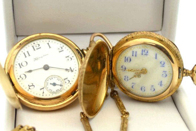 2 pocket watches, Hampden & ?: Two gold filled pocket watches, Hampden Dueber with white dial and fob is working, however other is not.