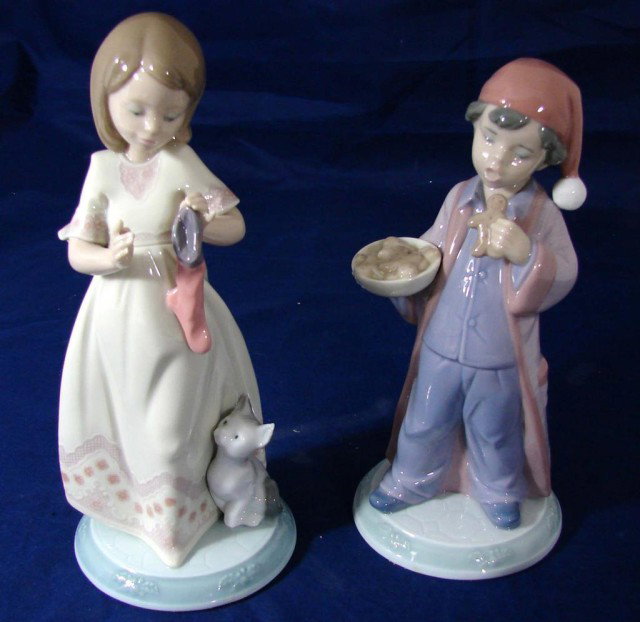 2 Lladro Boy & Girl - The Night Before Christmas: Lladro #6676 "Santa Won't Notice" and #6669 "A Stocking for Kitty", both from the Night Before Christmas Collection, issued in 2001; original box and packing.