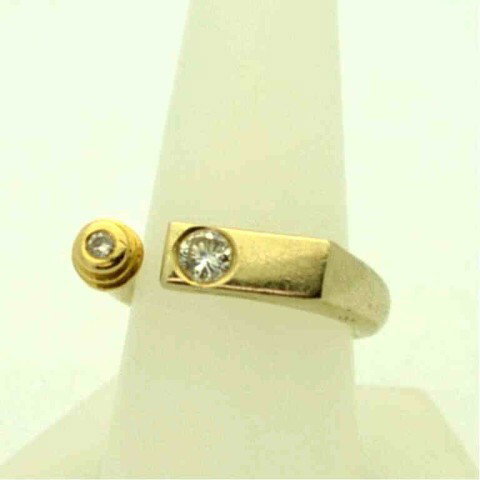 14k 2tone custom diamond ring: 14k 2tone custom diamond ring 10.2gr with 2 round diamonds flush mounted, weighing approx. .50ctw, split shank design, finger size 81/2.