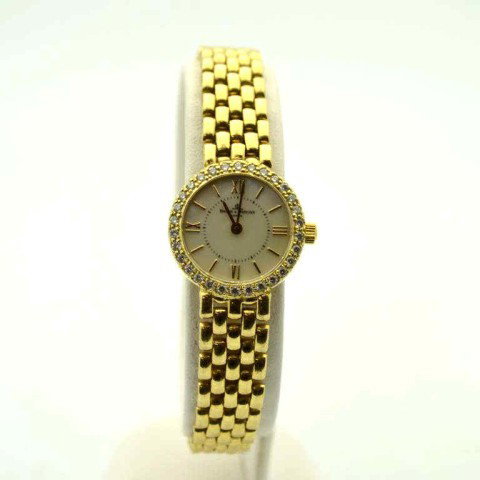 Lady's 14kyg Baume Mercier diamond watch: Lady's 14kyg Baume & Mercier diamond watch 26.5gr with round mother of pearl dial, diamond bezel, panther link band and adjustable clasp.