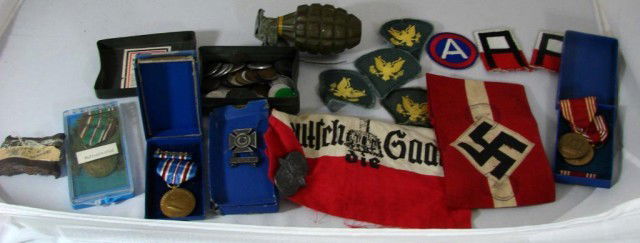 Lot of World War II & Nazi Memorabilia: Lot of World War II memorabilia including 5 medals, 7 patches, German swastika armband and handkerchief, piece of shrapnel, metal box full of coins, disarmed grenade,& a postage stamp album..