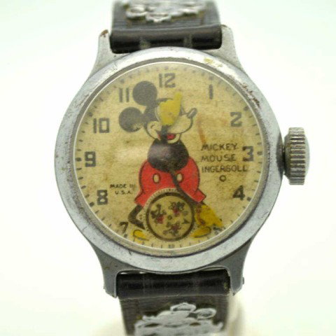 Vintage Ingersol Mickey Mouse watch: Vintage Ingersol Mickey Mouse wrist watch with silver case, original band and in good running condition.