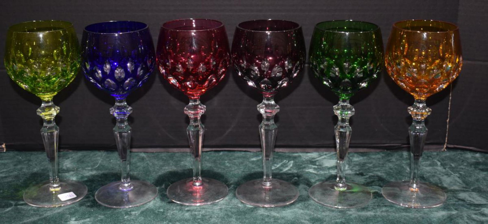 Group Of Colored Crystal Wine Glass: Group Of Colored Crystal Wine Glass. Total of 6 glasses in the group. Measures 8" in height. Colors are blue, red, green, lime, purple, yellow.