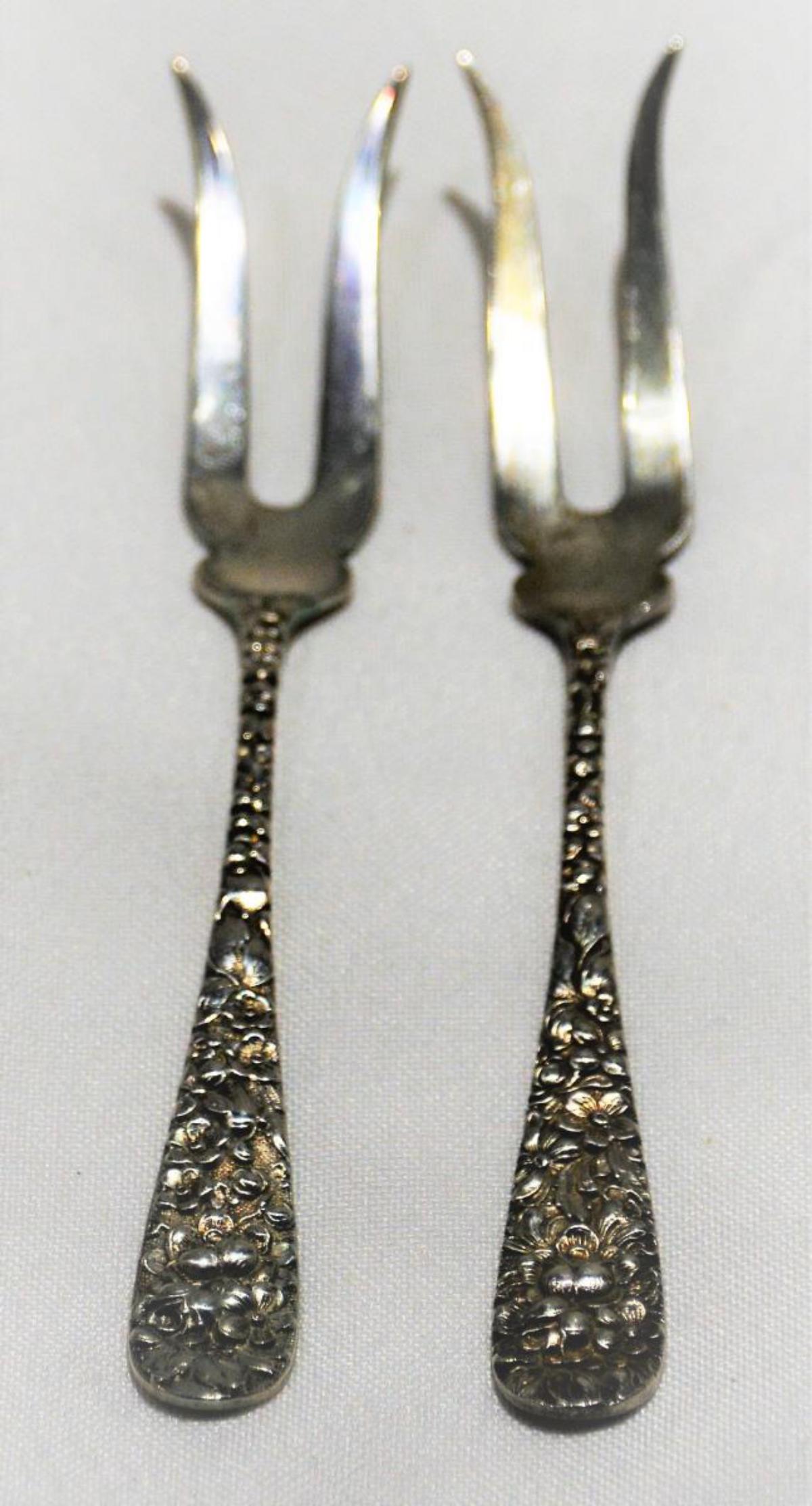 2 Stieff Sterling Rose Cocktail Pickle Forks: Two Sterling Silver Stieff floral Rose pattern Cocktail / Pickle forks. They have a combined weight of 0.87 ounces. Marked Sterling and signed Stieff.