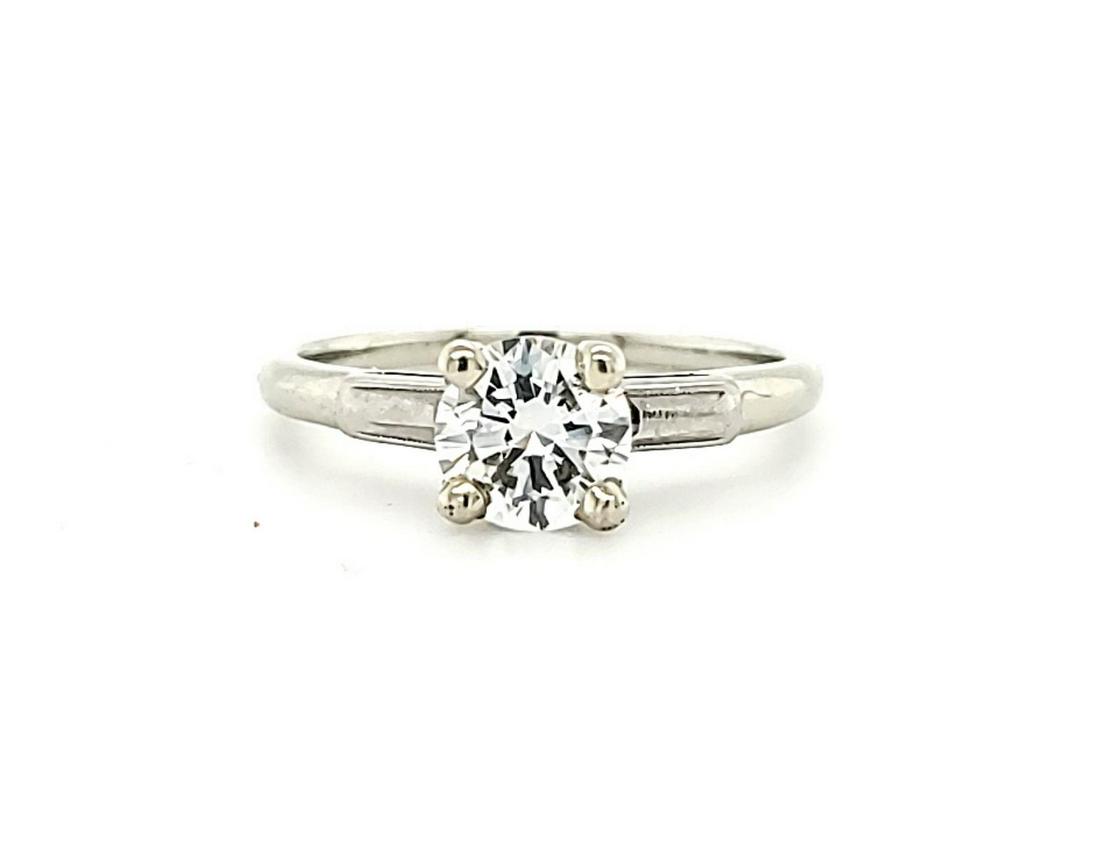 18kt white gold diamond solitaire ring: Ladies 18kt white gold diamond solitaire ring featuring a prong set round brilliant cut diamond weighing approx. 0.92ct., Clarity SI1, Color H. Finger size 7.5. Weight 2.9 grams.
