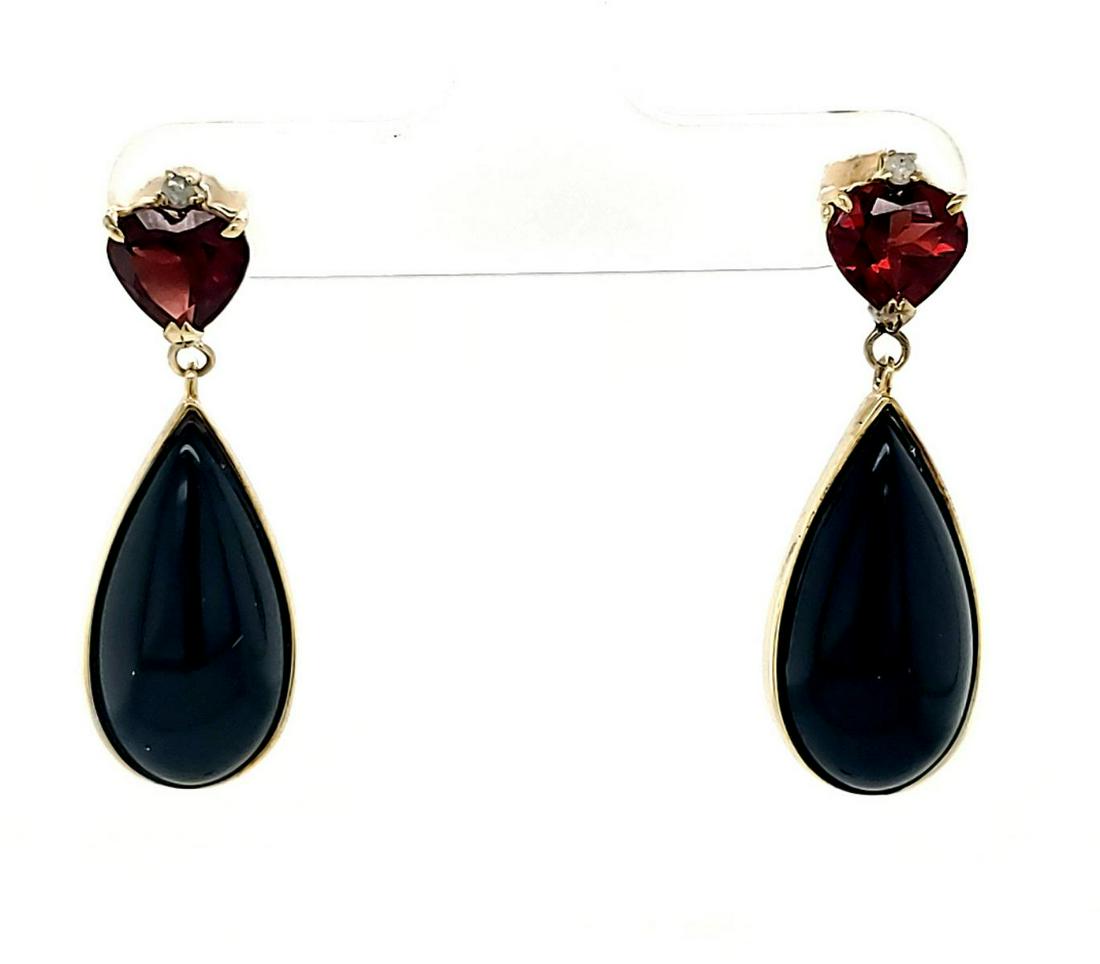 14kt yellow gold Onyx and Garnet Dangle Earrigns: Lady's 14kt yellow gold onyx an dgarnet dangle earrings featuring a 21x9mm pear shaped black onyx attached to a 7mm heart shaped garnet and one round diamond weighing approx. .03Ctw. Gross weight 5.8g