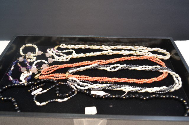 Lot of onyx, coral, pearl & hematite necklaces: Lot of onyx, coral, freshwater pearl and hematite necklaces with rose quartz, lapis and mother of pearl bracelets.