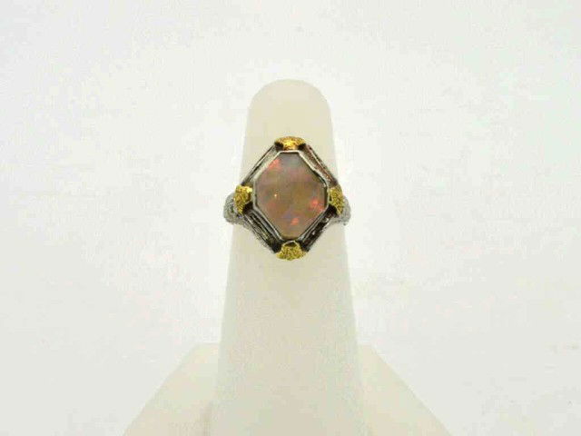 Vintage 14kwg opal ring: Vintage 14k opal ring 2.5gr with diamond shaped Australian opal 1/2" in length, yellow gold prongs and filigree setting, finger size 5.