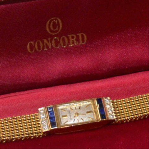 Lady's 14kyg Concord diamond watch: Lady's 14kyg Concord diamond watch 30.5gr, silver rectangular stick dial, square cut blue sapphires and prong set diamonds in the lugs .25ctw, quartz movement (have original mechanical movement) and 6