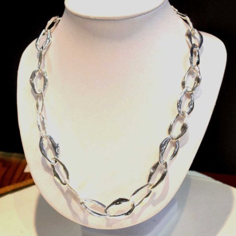 Sterling necklace,bracelet,ears by Tiffany & Co: Sterling jewelry ensemble by Elsa Peretti for Tiffany & Co, 6.6gr, freeform oval shaped 28" necklace with matching bracelet and earrings.