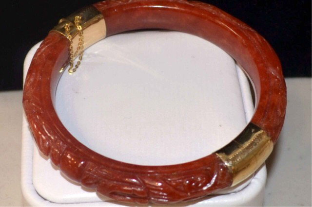 14kyg jade bangle bracelet: Red carved jade bangle bracelet with 14kyg clasp and hinge.