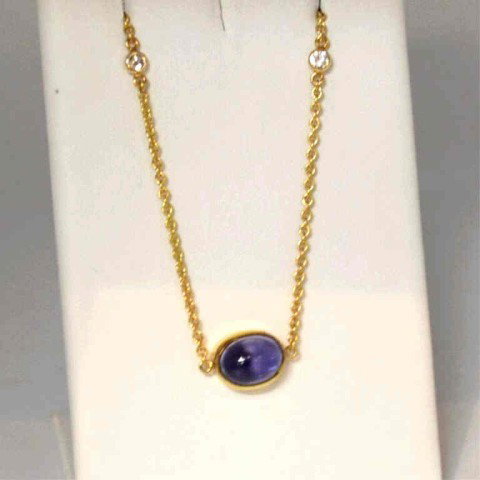 18kyg iolite & diamond necklace: 18kyg iolite and diamond necklace 5gr, bezel set cabochon iolite approx. 1ct, along with 2 bezel set diamonds in the 16" chain.