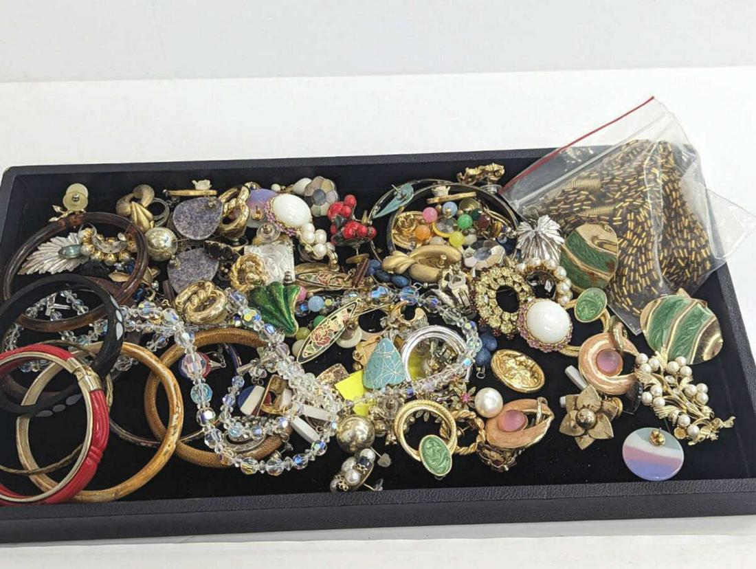 Costume Jewelry Lot Earrings Necklaces Bracelets: Costume Jewelry lot with earrings, bracelets, necklaces, and brooches with rhinestones, faux pearls and enamel. Several pieces are signed with Ciner, Lisner. May be missing a few stones.