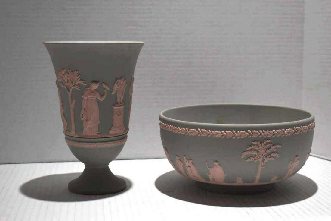 Pair Of Wedgwood Grecian Pink Collectibles: Pair Of Wedgwood Grecian Pink Collectibles. Consists of a vase measuring 7 1/2" in height. Round bowl measuring 4"x8". Exterior is decorated with Grecian style pink relief images. Both pieces of Wedgw