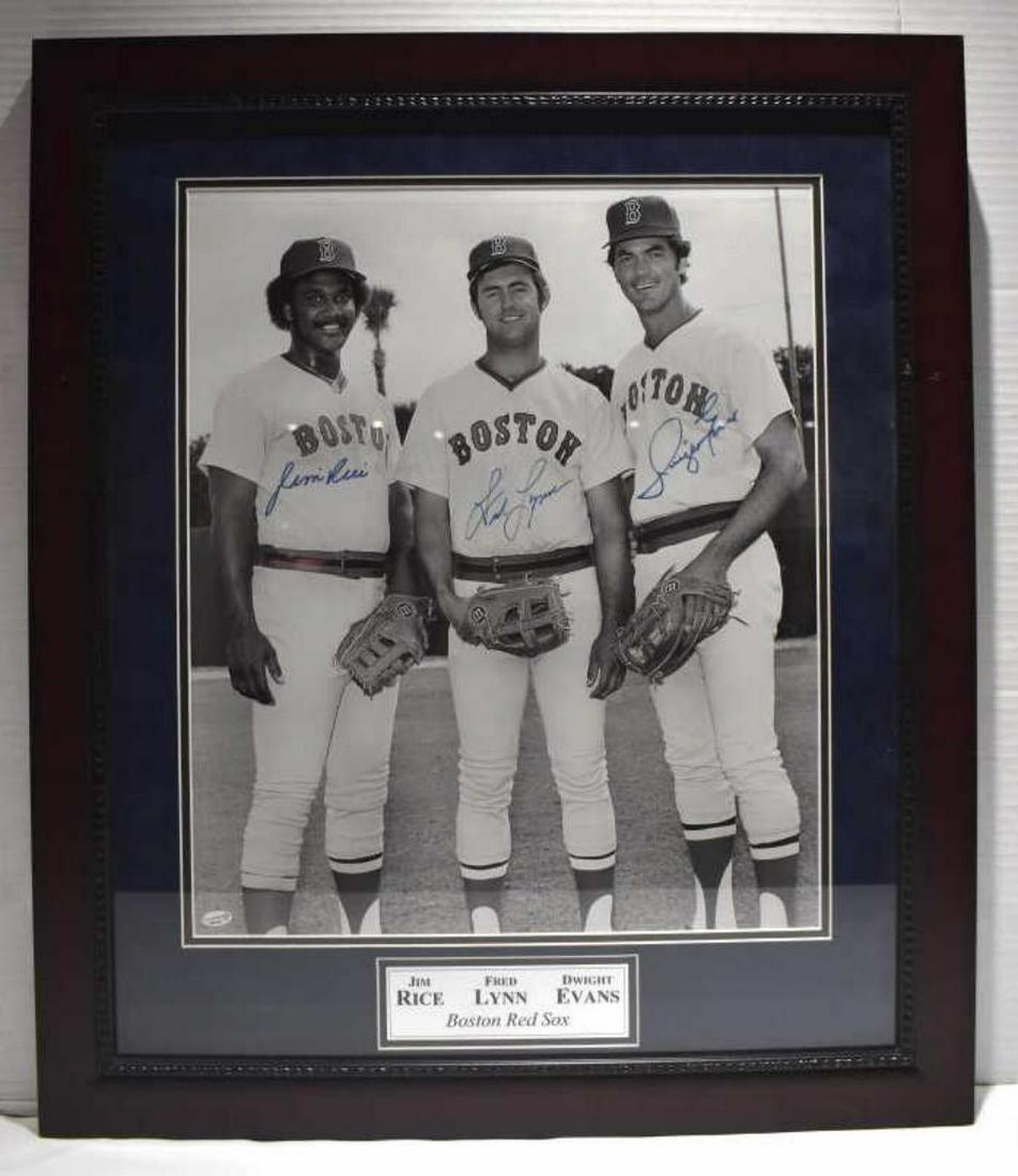 Signed Jim Rice, Fred Lynn, Dwight Evans Photo: Signed Jim Rice, Fred Lynn, Dwight Evans Photo. Measures 11 1/2"x27 1/2". Wood frame. There are some minor blemishes around the frame. Plaque at the bottom reads Jim Rice Fred Lynn Dwight Evans Boston