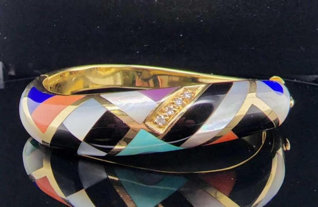 14kt yellow gold Asch-Grossbardt inlayed bracelet: Ladies 14kt yellow gold Asch-Grossbardt inlayed stone bangle bracelet inlayed mother of pearl, onyx, lapis lazuli and malachite and more, set in a geometric pattern. Accented with prong set round bril