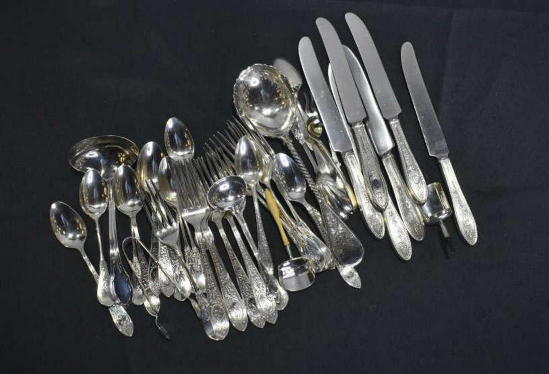 Group Of Sterling Silver Serving Utensils: Group Of Sterling Silver Serving Utensils. 37.5 ozt. Some of the serving utensils are monogrammed. Some of the pieces in the group include 6 dinner knives 9" in diameter. Butter knife 5 1/2" in diamet