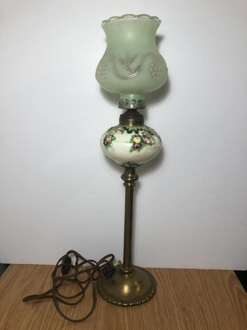Vintage Porcelain & Brass Hand Painted Table Lamp: Vintage Porcelain & Brass Hand Painted Table Lamp. Standing 19" tall, the middle section is hand-painted floral design and does show a few old faint crazing cracks. The top is frosted light green in c