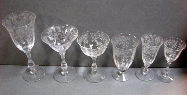 27 pcs. Fostoria Etched Stemware: 27 pcs. Fostoria Etched Stemware, 3 water 8.25", 6 martini, 6 champagne, 4 goblets, 4 sherry (or white wine) and 4 cordials. They are different patterns, but similar. No chips.
