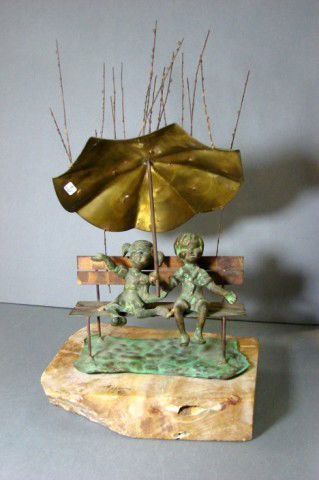 Signed Bijan Sculpture Copper & Bronze Children: Signed Bijan Sculpture Copper & Bronze - beautiful patina - 2 children under an umbrella in the rain; base probably granite. 12" t x 7" w x 6" deep.