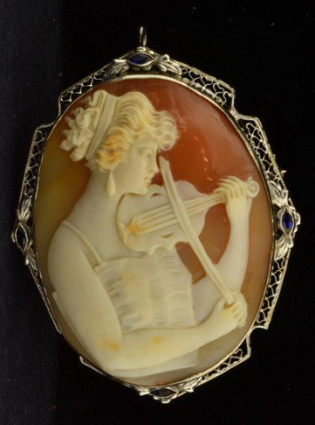 14k wg Filigree Cameo Brooch: 14k wg Filigree Cameo Brooch Woman Playing Violin Size 2 1/4 X 1 3/4 inches.