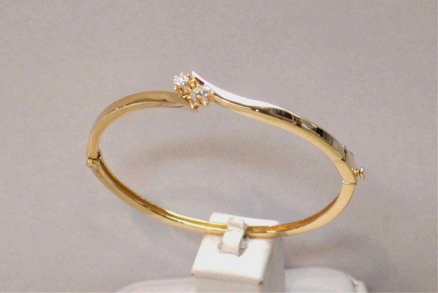 14k yg Diamond Bangle: 14k yg Diamond Bangle, 2 prong set diamonds .30ctw, high polished bypass design. 12gr