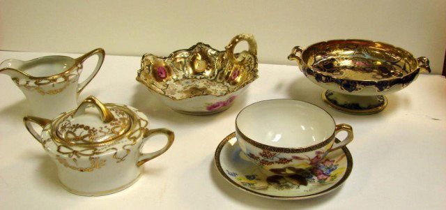 5 Pcs. Hand Painted Nippon, Lithophane Cup ++: Hand Painted Royal Nippon handled bowl, and a footed bowl 6" dia., both elaborately gilded, Nippon creamer & sugar, and a Lithophane cup & saucer with Japanese face in bottom; no chips in any piece.