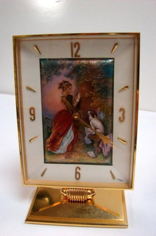 Arthur ImHof Hand Painted Enamel Desk Clock: Arthur ImHof Swiss Hand Painted Enamel Desk Clock, 5 1/2" high x 3 5/8" wide; 15 Jewels Swiss, painting is of a young girl carving a heart in a tree, watched by her dog, signed Richay, purch. in Canad