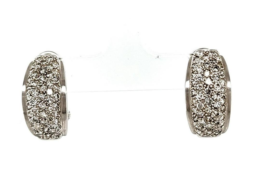 14kt white gold pave diamond earrings: Ladies 14kt white gold pave diamond earrings featuring pave set round brilliant cut diamonds weighing approx. 1.00ct. Clarity I1-I2, Color J-K. Finished with omega backs. Length 3./4". Weight 6.5 gram