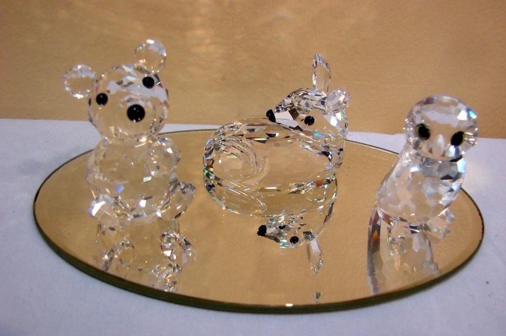 4 Swarovski Figs. Woodland Friends: 4 Swarovski Figs. from the Woodland Friends Collection: Deer, Owl & Bear; original boxes, squirrel, with round mirrors no box.