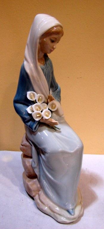 Lladro Girl with Calla Lillies & Girl w/Hood: Lladro Girl with Calla Lillies #4972, 9" tall, retired 1997and a girl with hood; missing wand; no chips; flowers intact. No box.