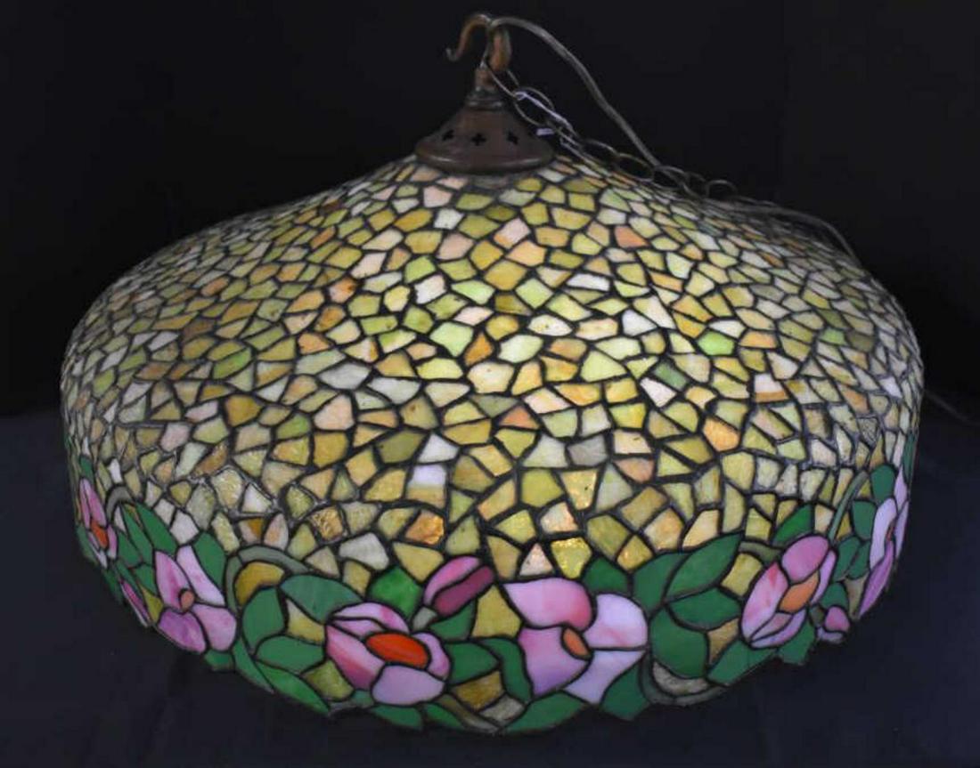 Leaded Stained Glass Hanging Lamp Shade: Leaded Stained Glass Hanging Lamp Shade. Measures 13"x23". Four bulb light sockets. Suspension chain. Decorated with rose bud pattern. Leaded stained glass hanging lamp shade is in great condition.