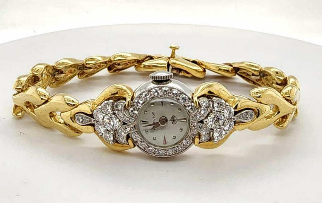18kt and platinum Hamilton diamond dress watch: Ladies 18kt and platinum Hamilton diamond dress watch featuring a platinum case accented with prong set round brilliant cut diamonds weighing approx. 1.24ct., Clarity SI1-SI2, Color G-H. Attached to a