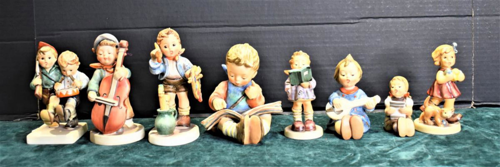 Group Of Hummels: Group Of Hummels. Total of 8 Hummels in the group. Sizes range from 3"-5 1/2" in height. Consists of Volunteers. Little knitter. The poet. The Artist. Boy reading book. Sweet Music. Joyful. Girl With 