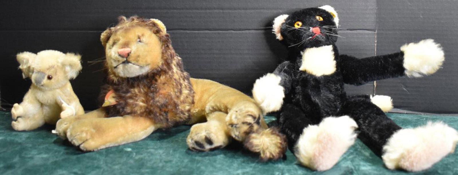Trio Of Steiff Stuff Animals: Group Of Steiff Stuff Animals. Consists of black cat. Measures 14" in height. Does not have the Steiff tag. Leo the lion. Measures 12" in height. Has Steiff tag. Koala Bear. Measures 5" in height. Doe