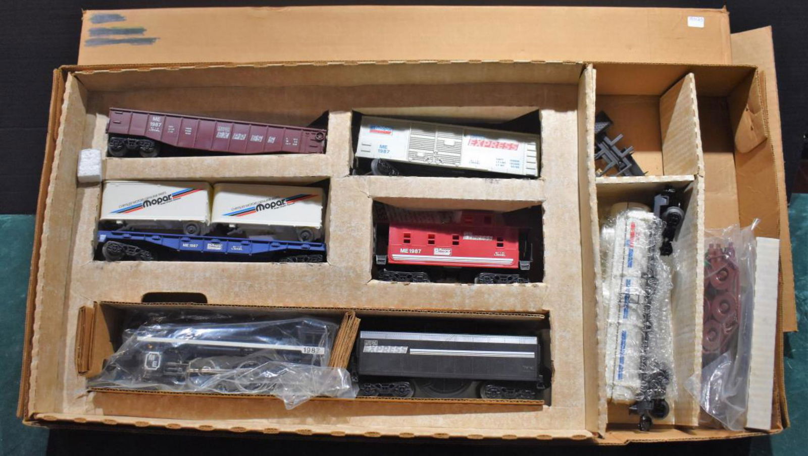 Lionel Mopar Express Electric Train Set 6-11757: Lionel Mopar Express Electric Train Set 6-11757. NW-2 Diesel Switcher w/ working headlight, Operating knuckle couplers metal wheels & Axles, Mopar Auto Carrier with sliding door, Mopar Gondola, Mopar