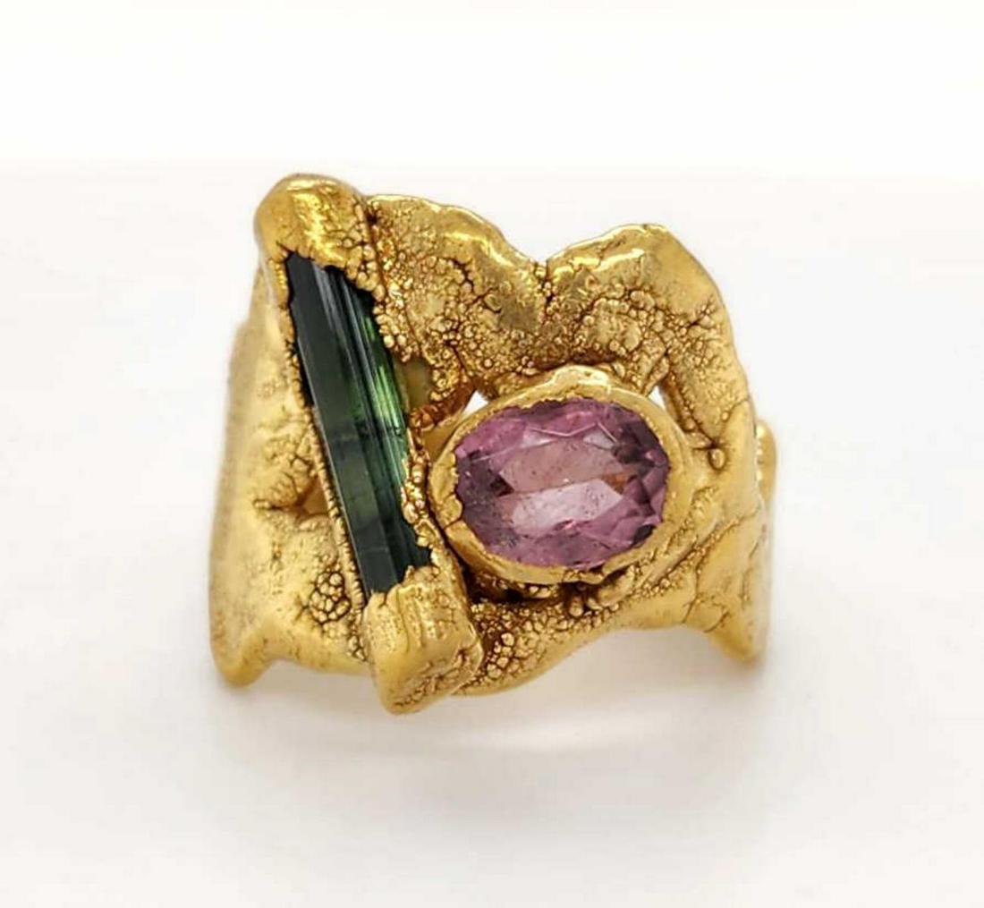 22kt yellow gold tourmaline fashion ring: Ladies 22kt yellow gold tourmaline fashion ring featuring pink and green tourmaline mounted in a freeform natural design. Top width 15mm. Finger size 4.5. Weight 9.2 grams