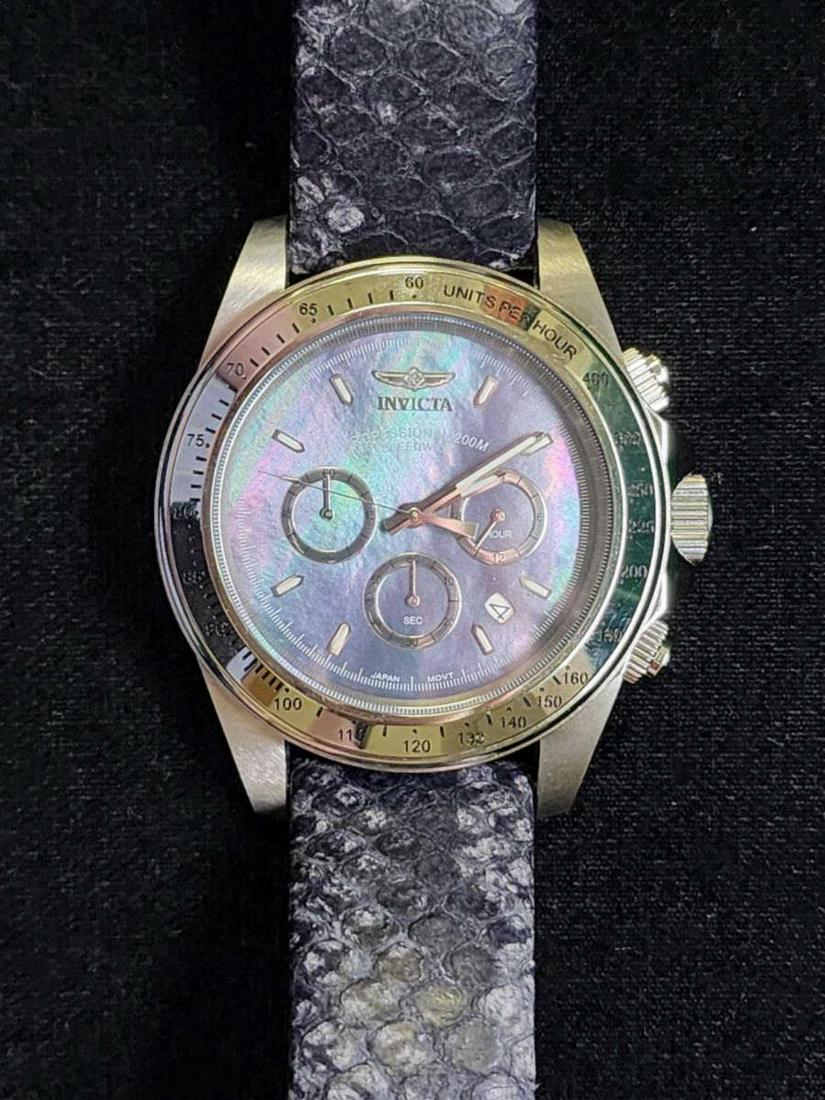 Men' s stainless Invicta Speedway Quartz watch: Men' s stainless Invicta Speedway Quartz watch, model #18394, featuring a mother of pearl dial with 3 sub-dials, stainless steel 45mm case, quartz movement and textured leather band. Comes with the or