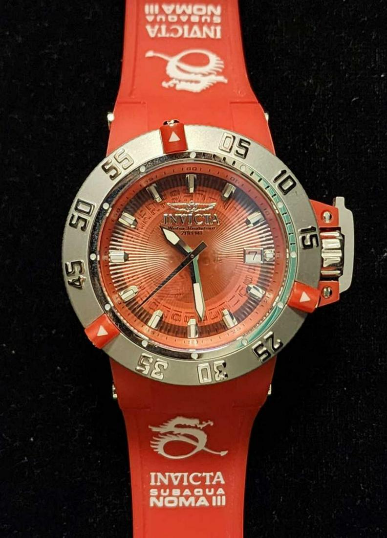 Ladies Invicta Subaqua Noma III watch: Ladies Invicta Subaqua Noma III watch, model # 10110, featuring 42mm case, quartz movement, red textured dial with stick markers, wide stainless bezel and red silicone band. Comes with the original bo