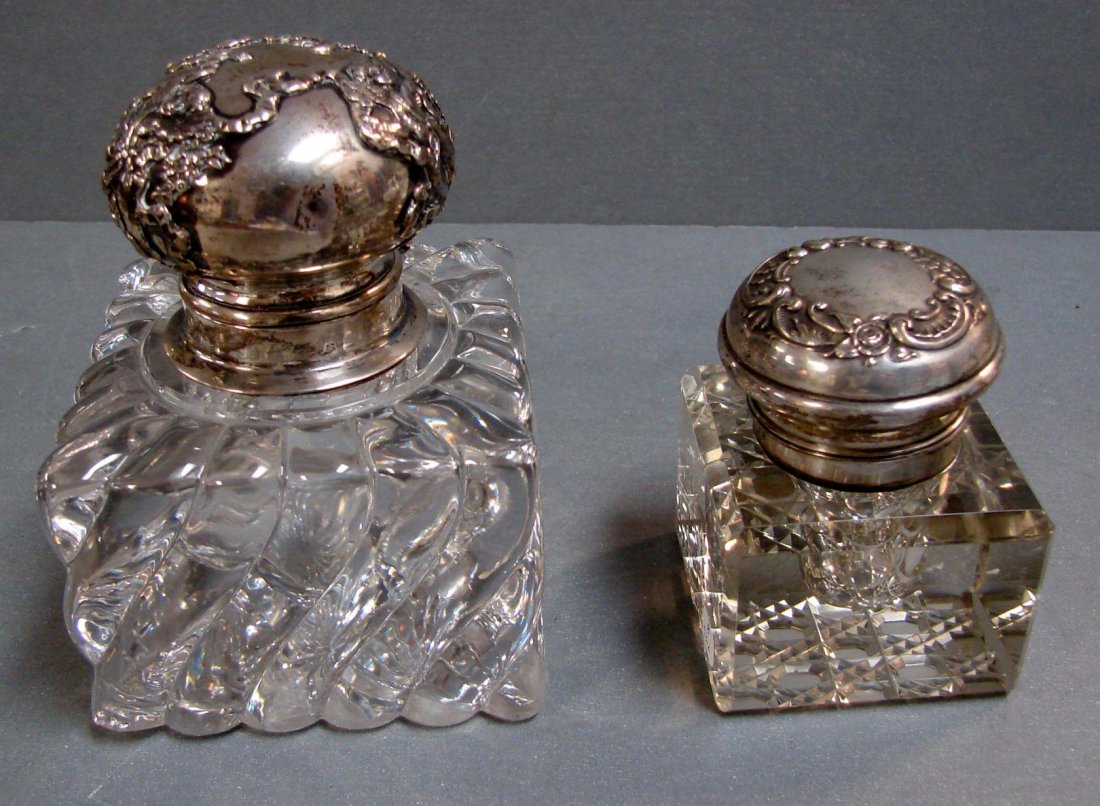 2 Antique Inkwells with Sterling Silver Tops: 2 Antique Inkwells with Sterling Silver Tops, one is 3.5" square, approx. 5" tall, chip on bottom corner, approx. 1/4", top is loose & weighs 3 oz., the other is 2.5" sq. x 3" tall, no chips.