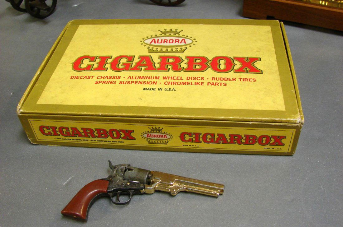 12 Cigar box Miniature Cars & Miniature Cap Pistol: 12 Cigar box Miniature Cars in original case & Miniature Cap Pistol, 5" long.