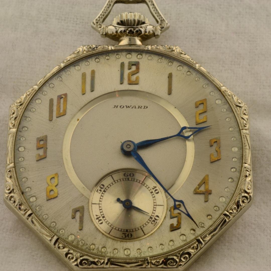 14k wg Howard Pocket Watch: 14k wg Howard Pocket Watch. Open face with outer dial. 42 mm case with second hand sub dial at 6 o'clock position. Ornate scrolling on case. Running. 53gr