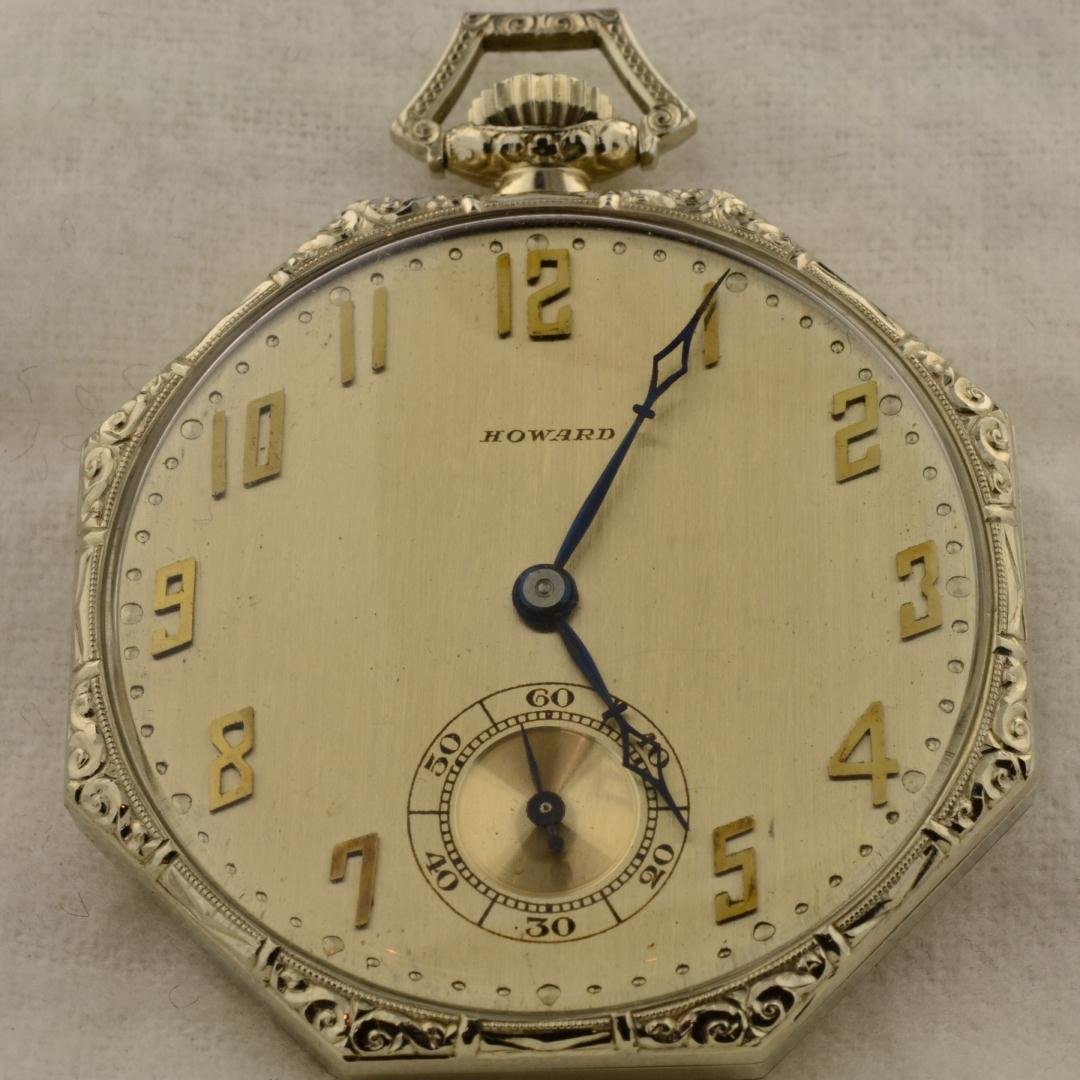 14k wg Howard Pocket Watch: 14k wg Howard Pocket Watch. 42mm wide case. Second hand sub dial at 6 o'clock position. Ornate scrolling on case. Running. 50.9gr