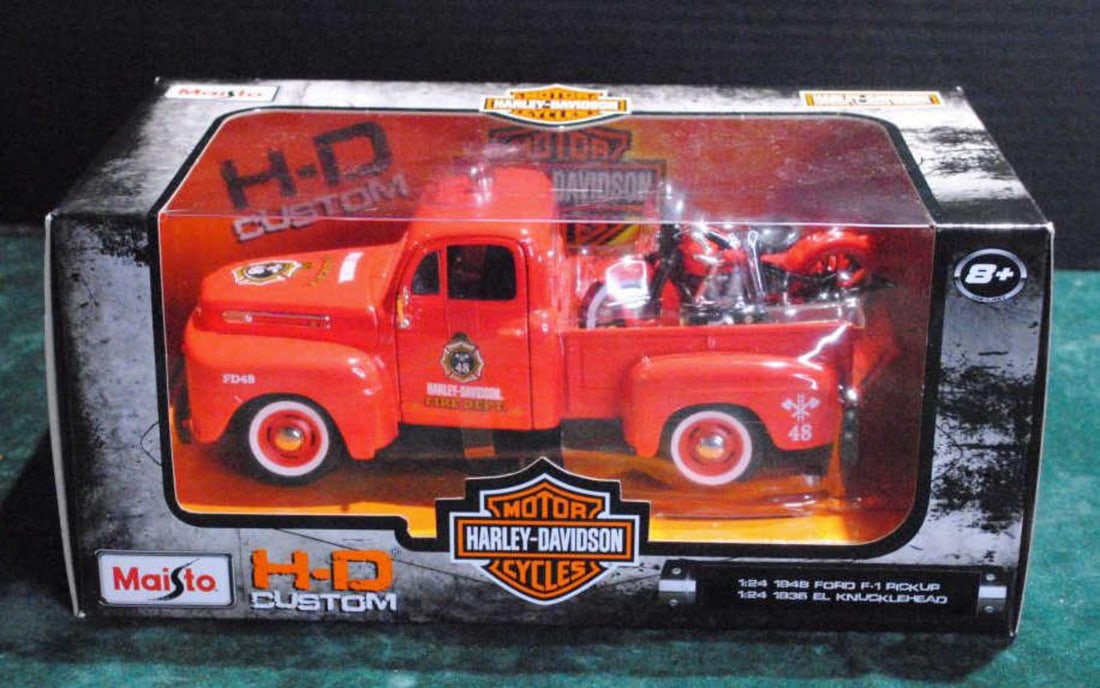 Maisto Harley Davidson Motorcycle/Truck Set: Maisto Harley Davidson Motorcycle Truck Set. Brand new in box. Never opened. 1948 Ford F1 in orange for the fire department. Also 1936 knucklehead motorcycle in orange w/ black accents. 1:24 scale