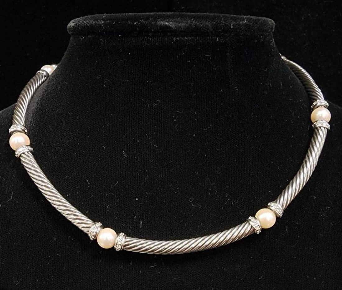 Sterling David Yurman Metro Cable Station necklace: Ladies sterling silver David Yurman Metro Cable Station link necklace featuring a twisted cable design separated by creamy white pearls measuring 7mm and prong set round brilliant cut diamonds weighin