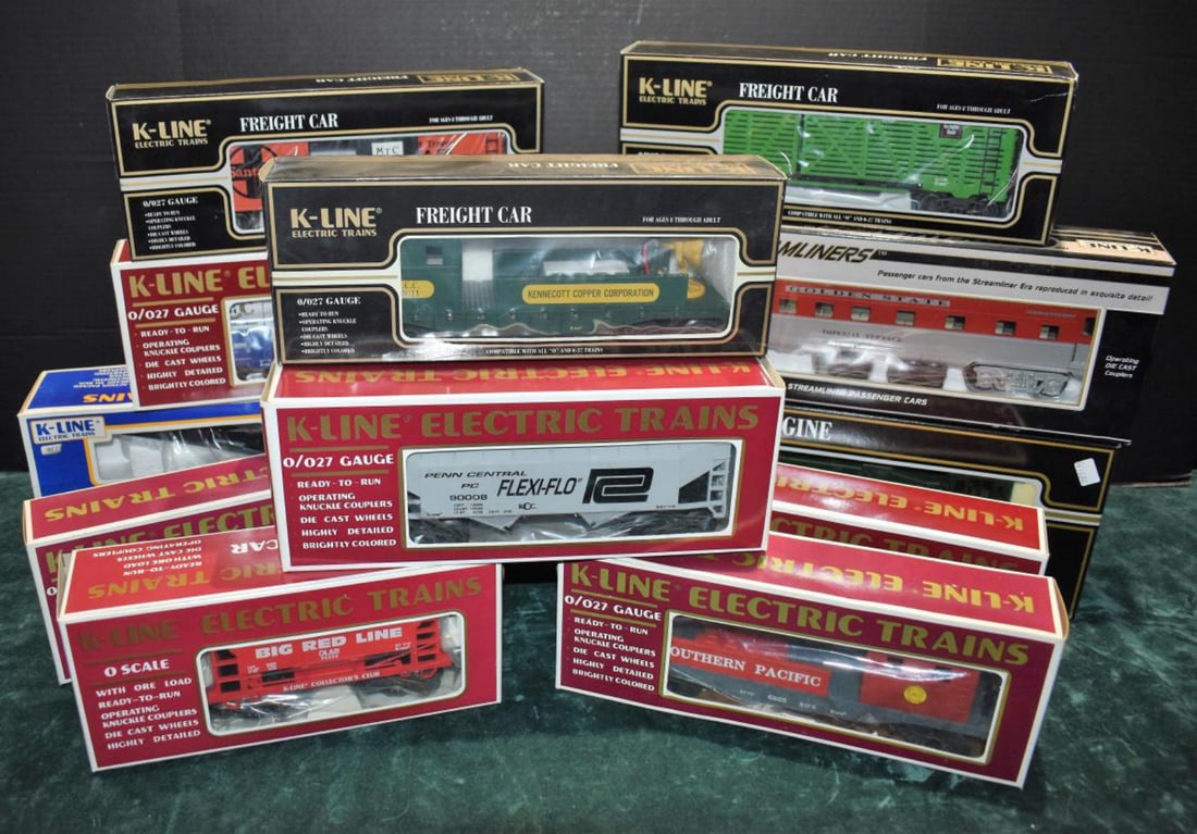 13pc K-Line Train Lot K-6855 K-6806 K-90009: 13 piece K-Line Electric Train Lot including; Southern Pacific Boom Car K-6855, Southern Pacific Crane car K-6806, CB&Q Stock car k-90009, Santa Fe Reefer K 90010, KCC Freightcar, Baker's Chocolate Ta