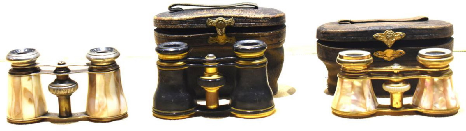 Trio Of Opera Binoculars: Trio Of Opera Binoculars. Consist of Chevalier opera binocular. Made of brass and mother of pearl. Product of Paris. Measures 4"x2". Lefils opera binocular. Comes with leather case. Made of brass and 